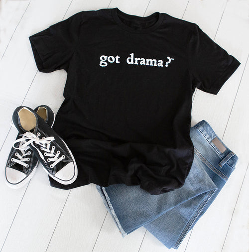 Black got drama? t-shirt flatlay with sneakers and jeans